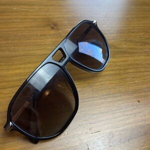 Authentic Rag and Bone black sunglasses with a modern square silhouette.